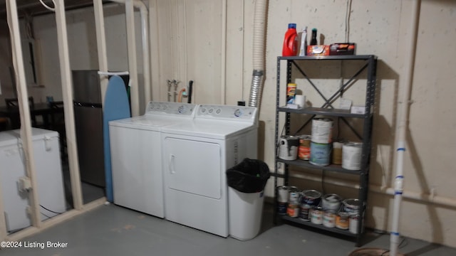 laundry area with independent washer and dryer