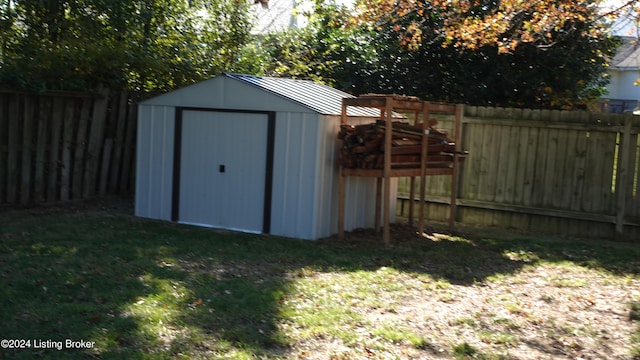 view of outbuilding featuring a yard