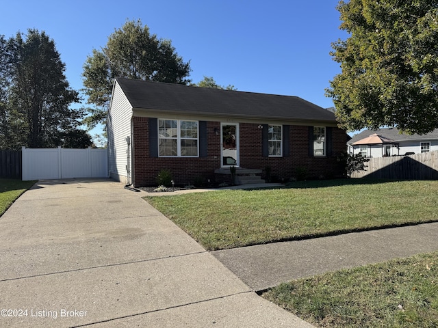 bungalow-style home with a front yard