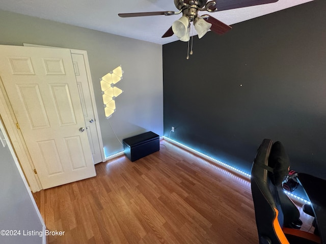 unfurnished room with ceiling fan and wood-type flooring