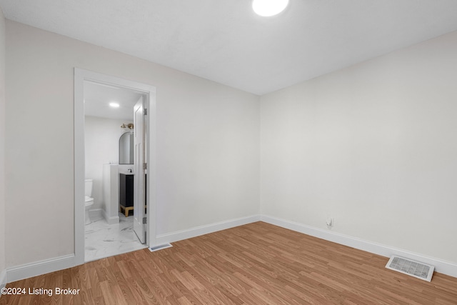 unfurnished room featuring light hardwood / wood-style floors