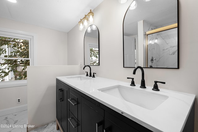 bathroom with vanity and a shower with shower door