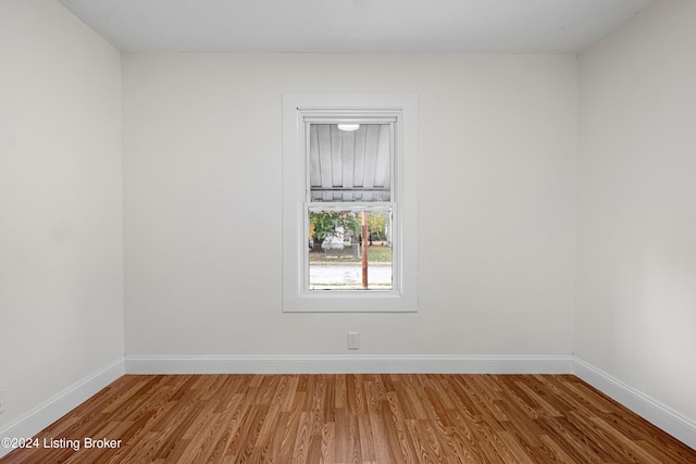 unfurnished room featuring hardwood / wood-style floors