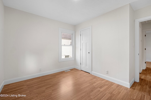 empty room with light hardwood / wood-style floors