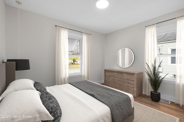 bedroom with wood-type flooring