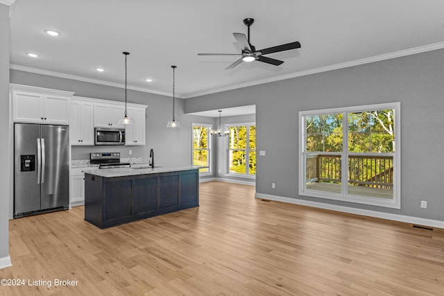 kitchen with light hardwood / wood-style flooring, white cabinetry, stainless steel appliances, and an island with sink