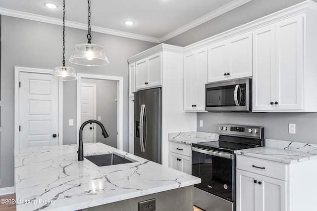 kitchen featuring sink, appliances with stainless steel finishes, decorative light fixtures, and white cabinetry