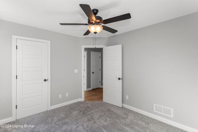 unfurnished bedroom with carpet and ceiling fan