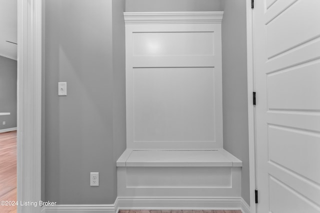 mudroom with wood-type flooring