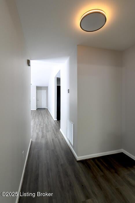 hall with dark hardwood / wood-style flooring