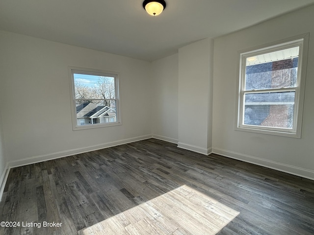 unfurnished room featuring dark hardwood / wood-style floors