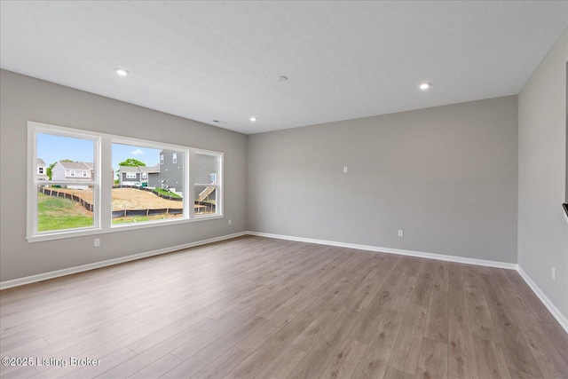 8801 Legendary Ln, Louisville, KY 40229 - empty room with wood finished floors, baseboards, and recessed lighting