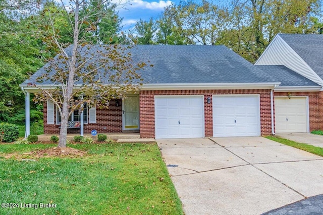 view of front of home with a porch, a front lawn, and a garage