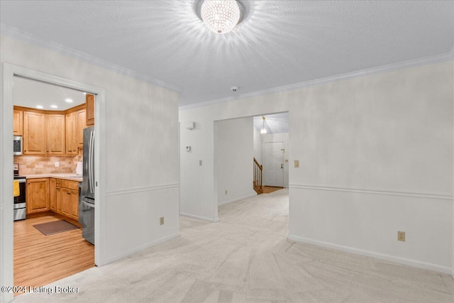 living room featuring light carpet, crown molding, and a textured ceiling