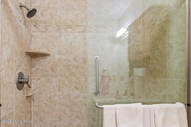 bathroom with tiled shower