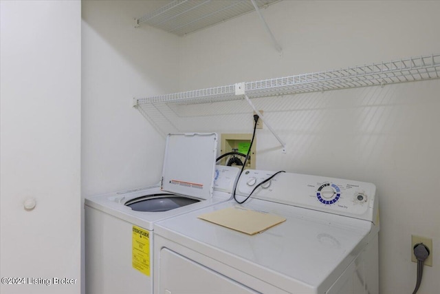 laundry area with washer and clothes dryer