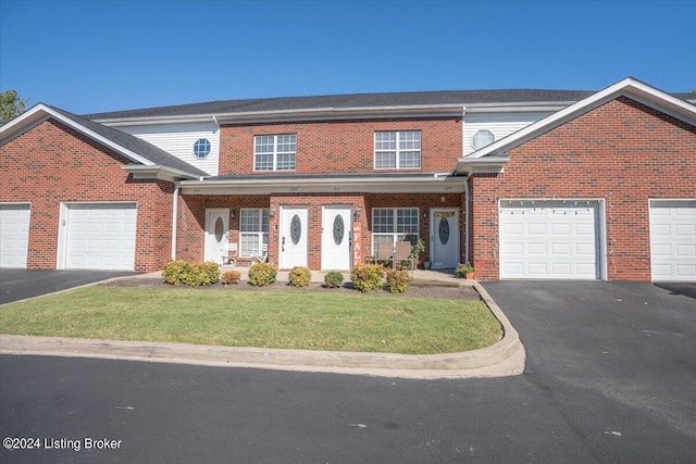 view of front of house featuring a porch and a front yard