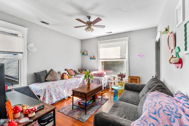 bedroom with ceiling fan and hardwood / wood-style floors