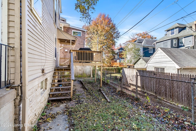 view of yard with a wooden deck