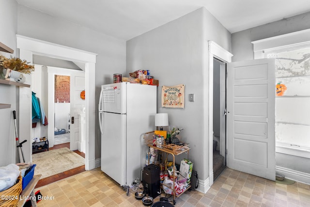 kitchen featuring white fridge