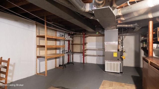 basement featuring heating unit