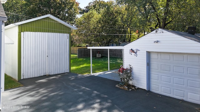 garage with a lawn