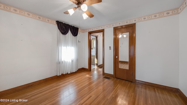 unfurnished room featuring ceiling fan and light hardwood / wood-style flooring