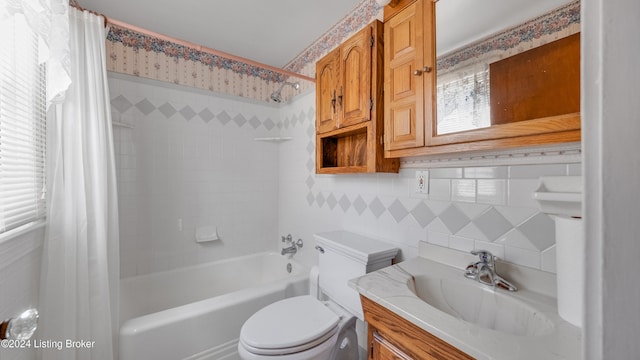 full bathroom featuring shower / bath combo, toilet, tile walls, vanity, and decorative backsplash