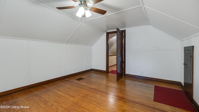 bonus room featuring lofted ceiling, hardwood / wood-style floors, and ceiling fan