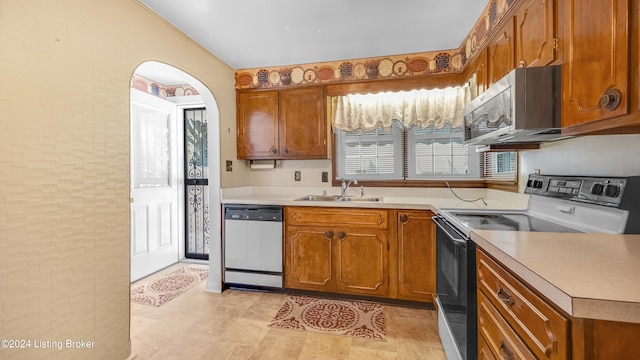 kitchen featuring sink and white appliances