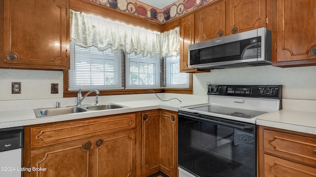 kitchen with sink and white appliances