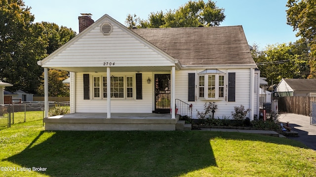 bungalow-style home featuring a front yard