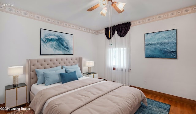 bedroom featuring wood-type flooring and ceiling fan