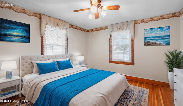 bedroom featuring hardwood / wood-style flooring and ceiling fan