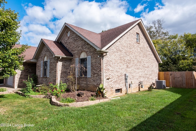 view of property exterior with central air condition unit and a lawn