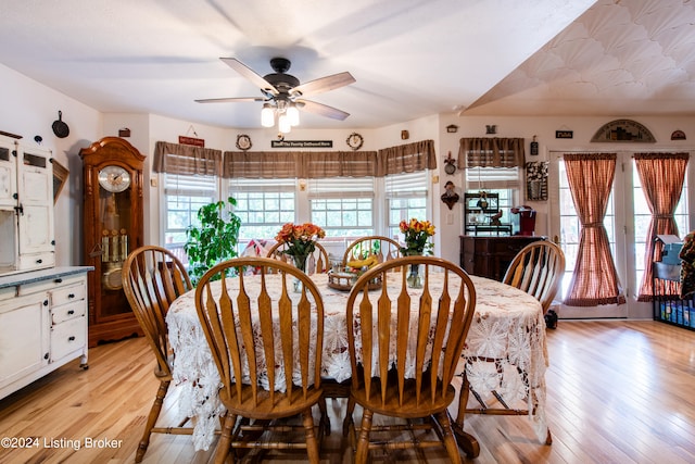 dining room with light wood-type flooring and ceiling fan