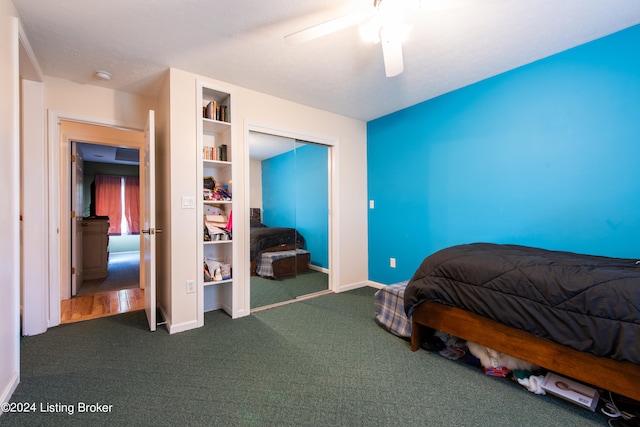 carpeted bedroom featuring a closet and ceiling fan