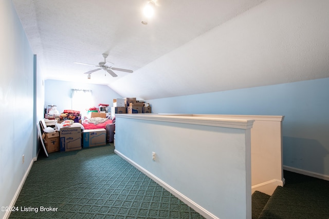 carpeted bedroom with ceiling fan and lofted ceiling