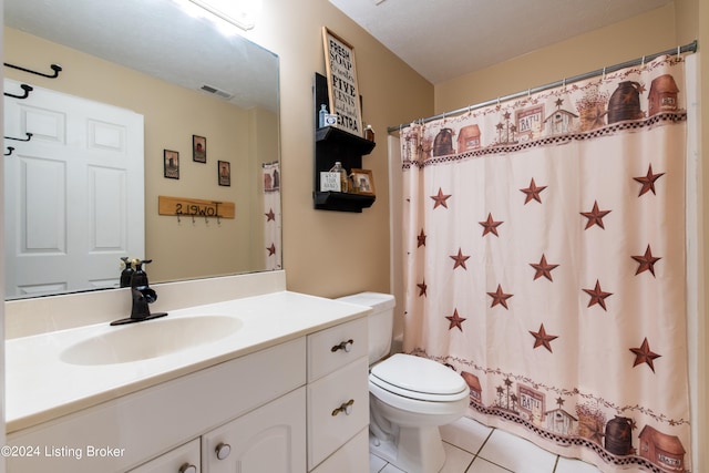 bathroom with vanity, toilet, tile patterned flooring, and a shower with shower curtain