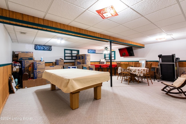 game room with a paneled ceiling, billiards, wooden walls, and carpet floors