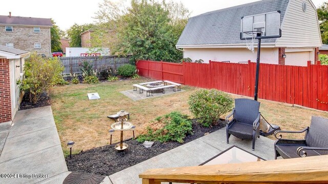 view of yard with a patio area and a fire pit