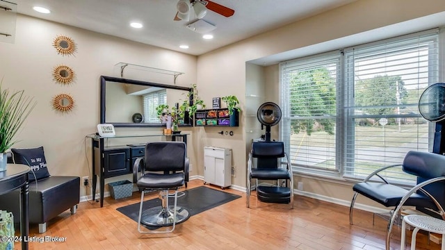 sitting room featuring light wood-type flooring and ceiling fan