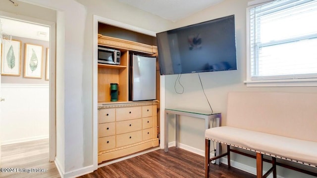 living area with dark hardwood / wood-style flooring