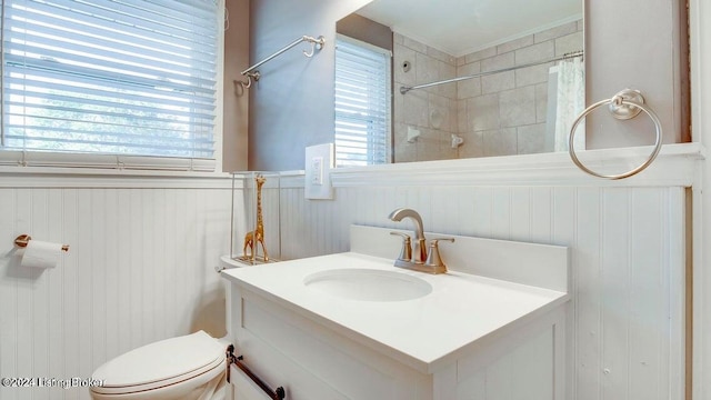 bathroom featuring vanity, toilet, and curtained shower