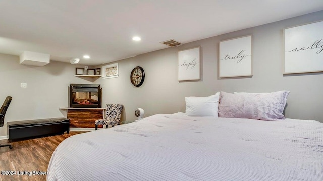 bedroom with wood-type flooring