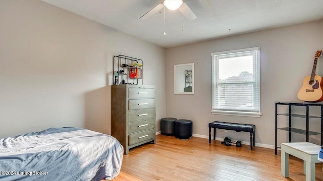 bedroom featuring light hardwood / wood-style floors and ceiling fan