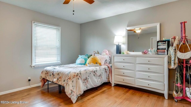 bedroom with light wood-type flooring and ceiling fan