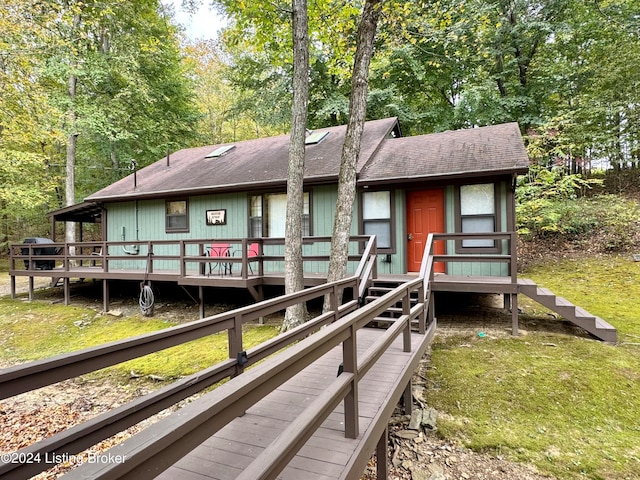 308 Oak Rd, Falls Of Rough, KY 40119 - rear view of property featuring a deck and a lawn