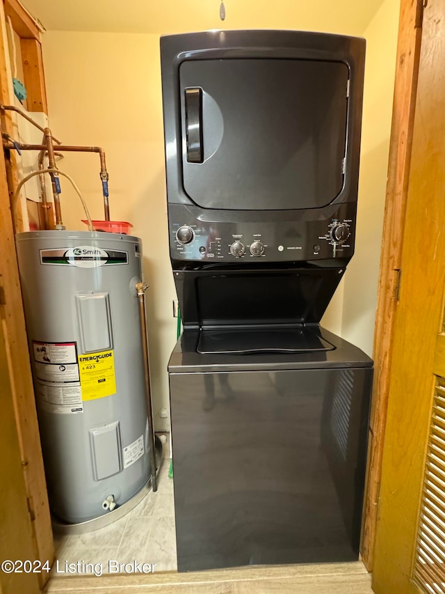 308 Oak Rd, Falls Of Rough, KY 40119 - laundry area with stacked washer / drying machine, electric water heater, and tile patterned flooring