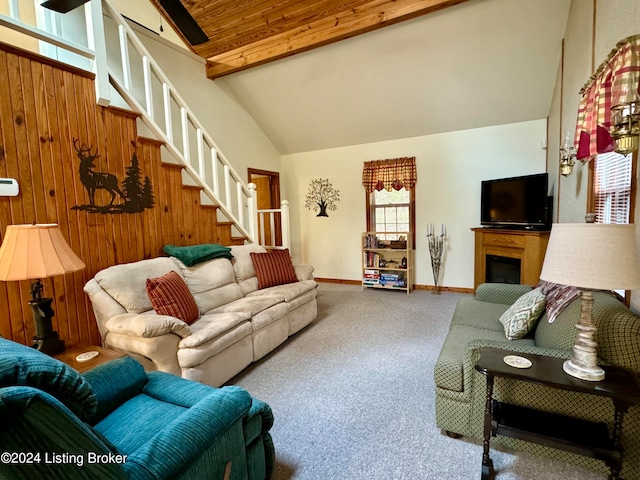 308 Oak Rd, Falls Of Rough, KY 40119 - living room with beam ceiling, carpet flooring, high vaulted ceiling, and wood walls